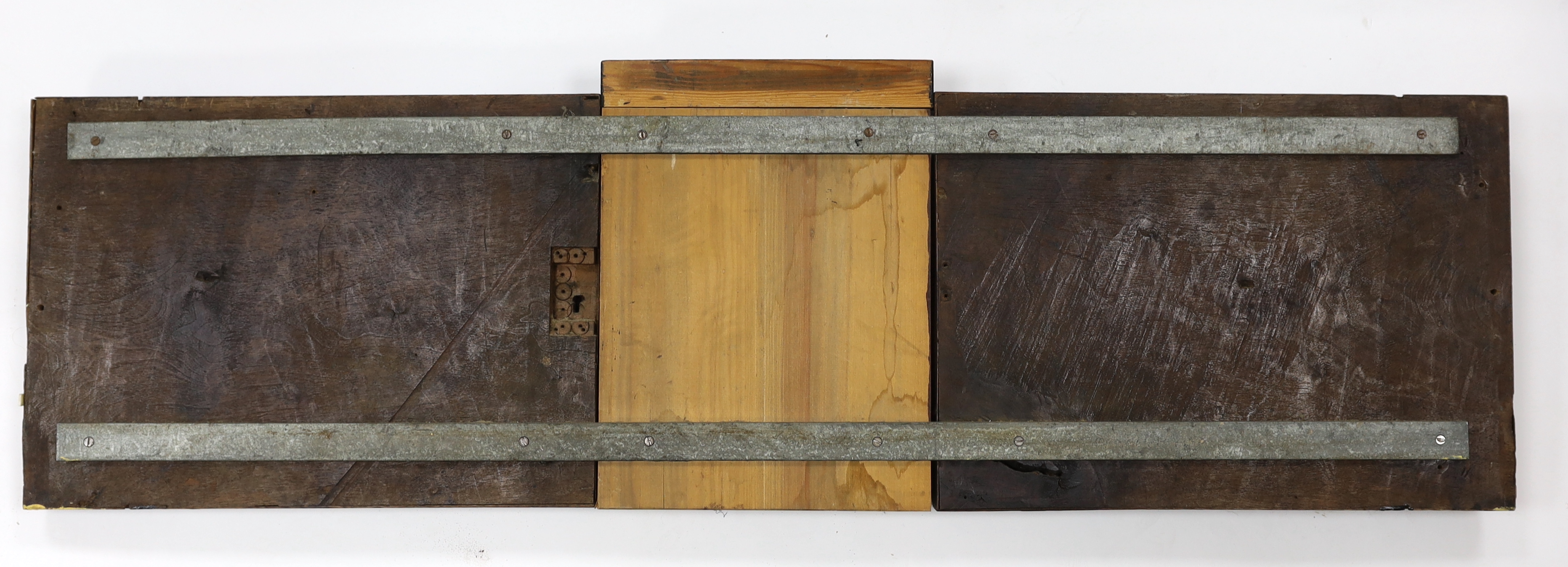 A 17th century French carved walnut triptych panel, 121cm wide, 37cm high